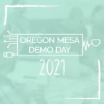 White text on a teal background reads OREGON MESA DEMO DAY 2021 with tech-themed graphics and a heart-shaped line. Blurred people and laptops are visible in the background.